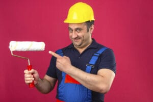 Man Pointing Out Paint Roller
